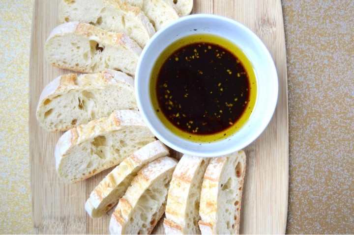 Sliced ciabatta baguette with balsamic vinegar dip side dish. Romantic dinner menu for a date night in in that you can make in 15 minutes! Quick + easy fancy meal at home. Pasta main course, salad, + side dish recipes.