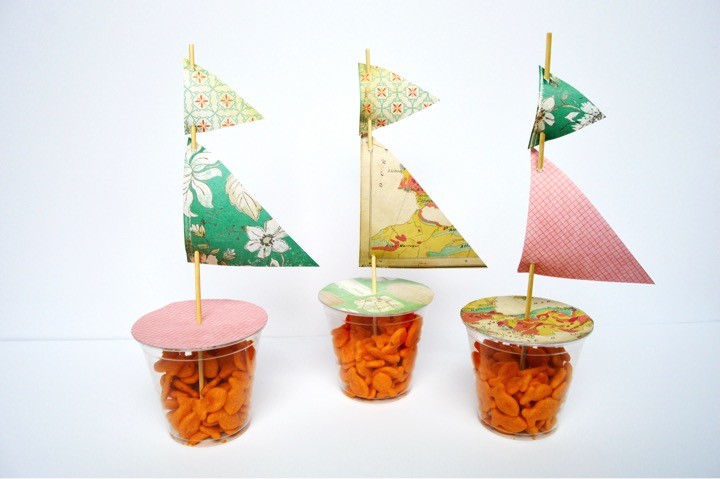 DIY Goldfish cracker party favor cups. Sailing baby shower inspiration with a nautical theme. Food, party decorations, invitation, games, + gift ideas for an adventure sailing girl's baby shower.