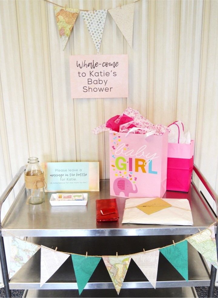 Welcome table. Sailing baby shower inspiration with a nautical theme. Food, party decorations, invitation, games, + gift ideas for an adventure sailing girl's baby shower.