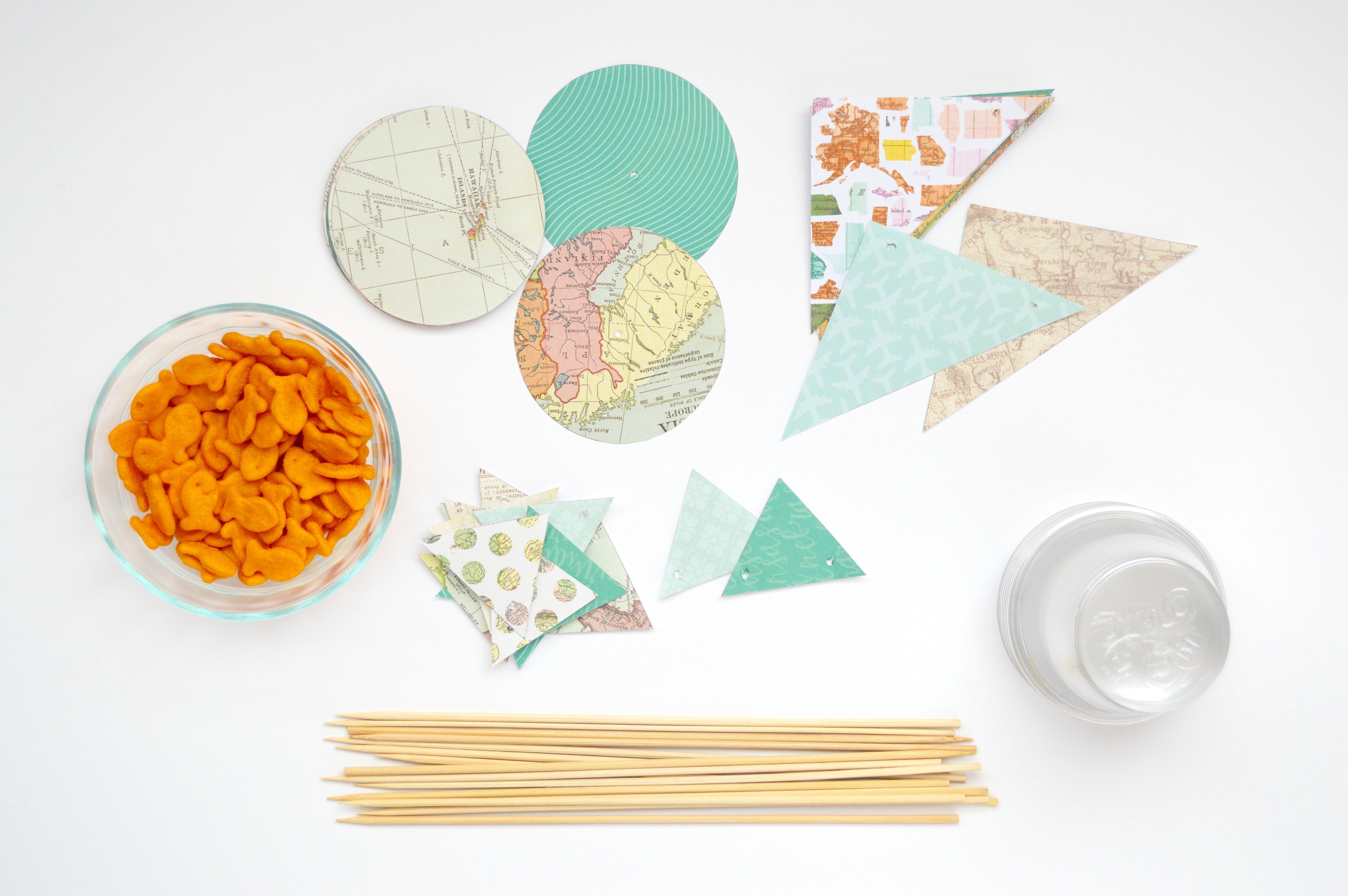 Supplies needed for this craft. Tutorial for how to make Goldfish sailboat party favors for a baby shower, bridal shower, or party. Cute nautical, sailing, travel, + adventure theme ideas.