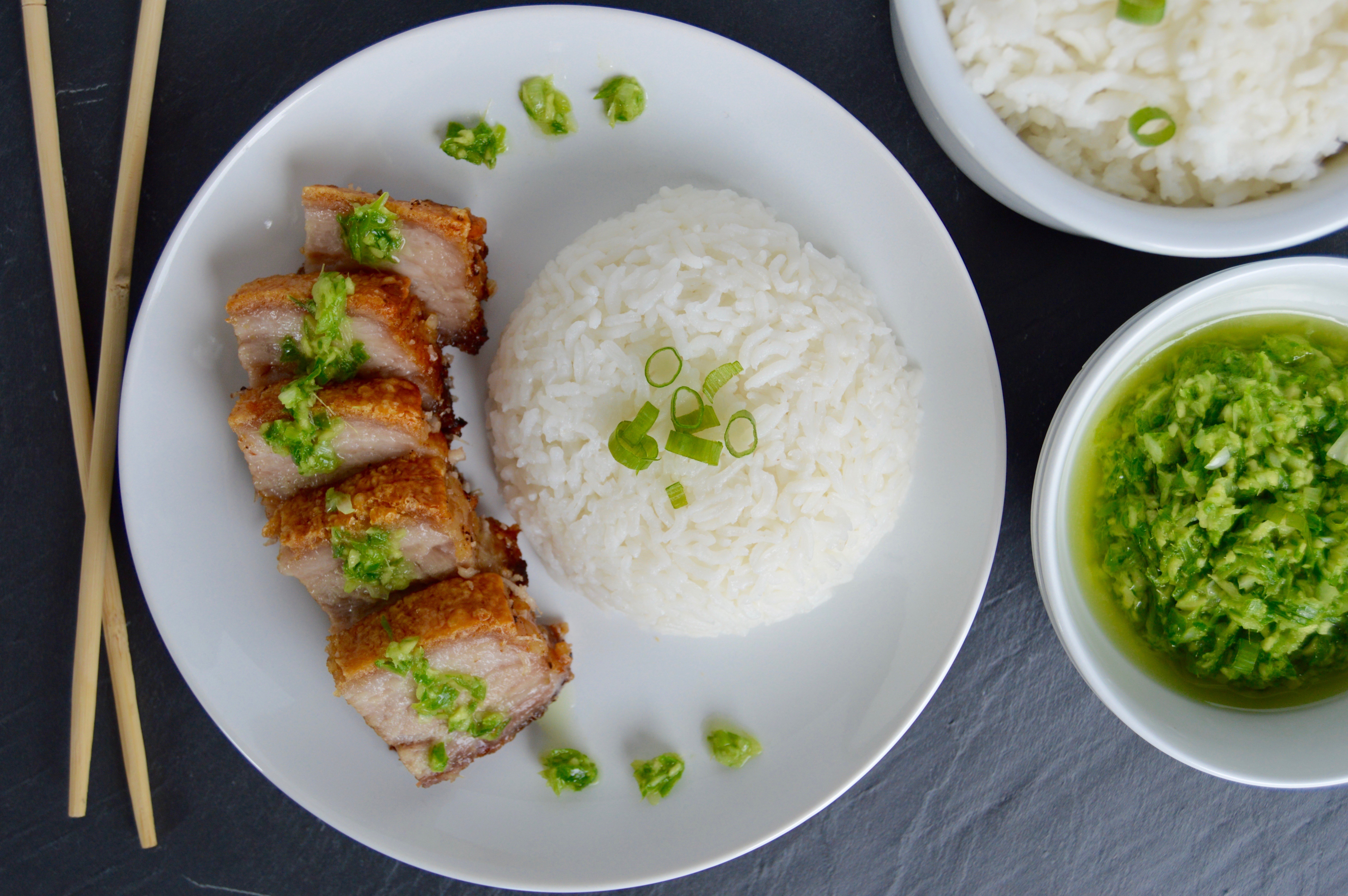 Hong Kong style crispy pork belly recipe | Delicious Asian dinner idea | savory, salty dish like bacon on steroid served with a ginger green onion sauce and white rice | Beautiful Chinese food | Pork Belly baked in the oven under salt