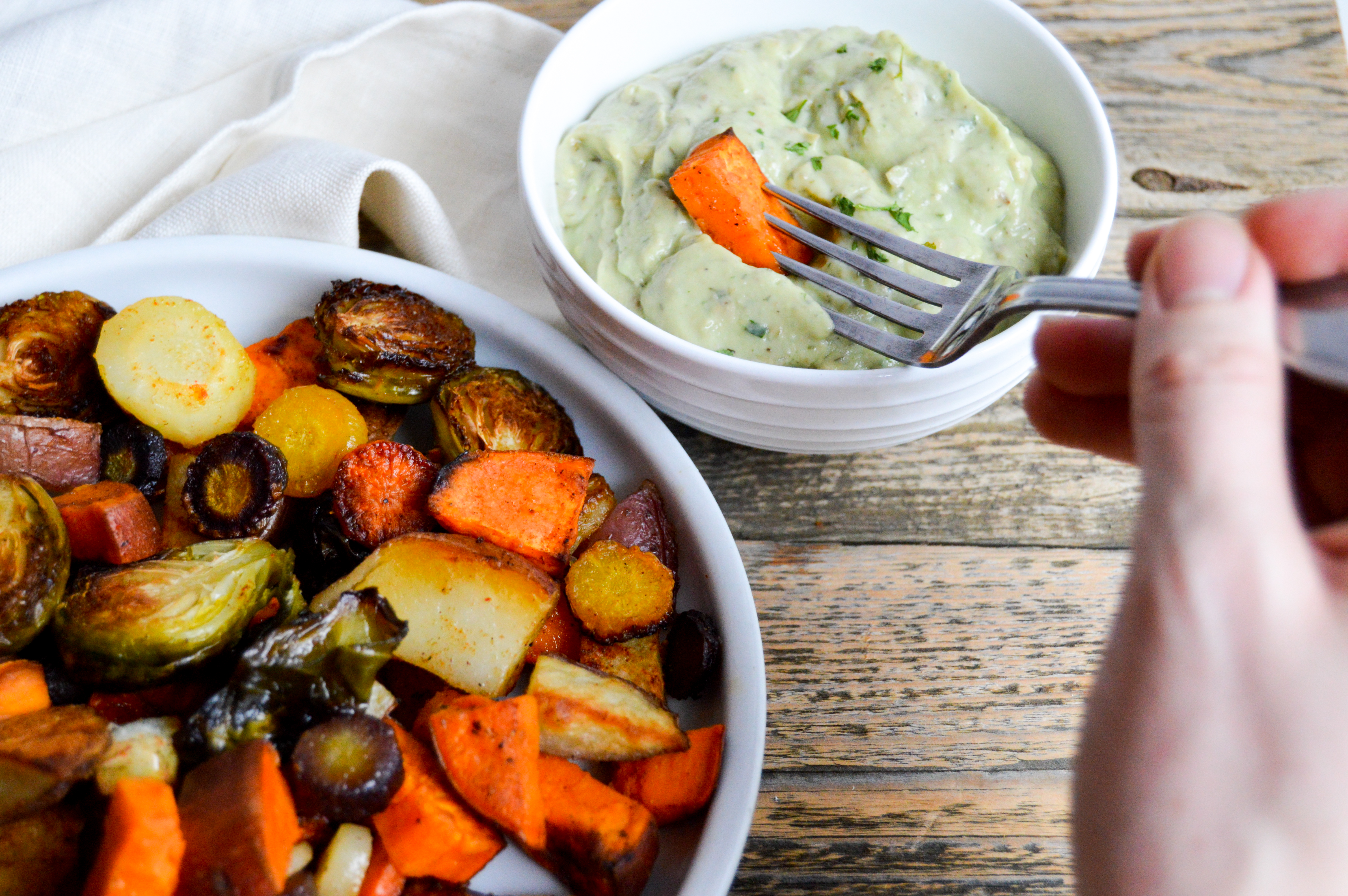 Recipe for baking hearty sheet pan veggies and avocado ranch dip recipe. Vegetable filled dinner idea for a healthy meal. Corn oil and avocado substitutions. Rainbow carrots, brussels sprouts, sweet potato, and red potato veggies baked with corn oil and seasonings. Delicious, easy, healthy dinner dish.