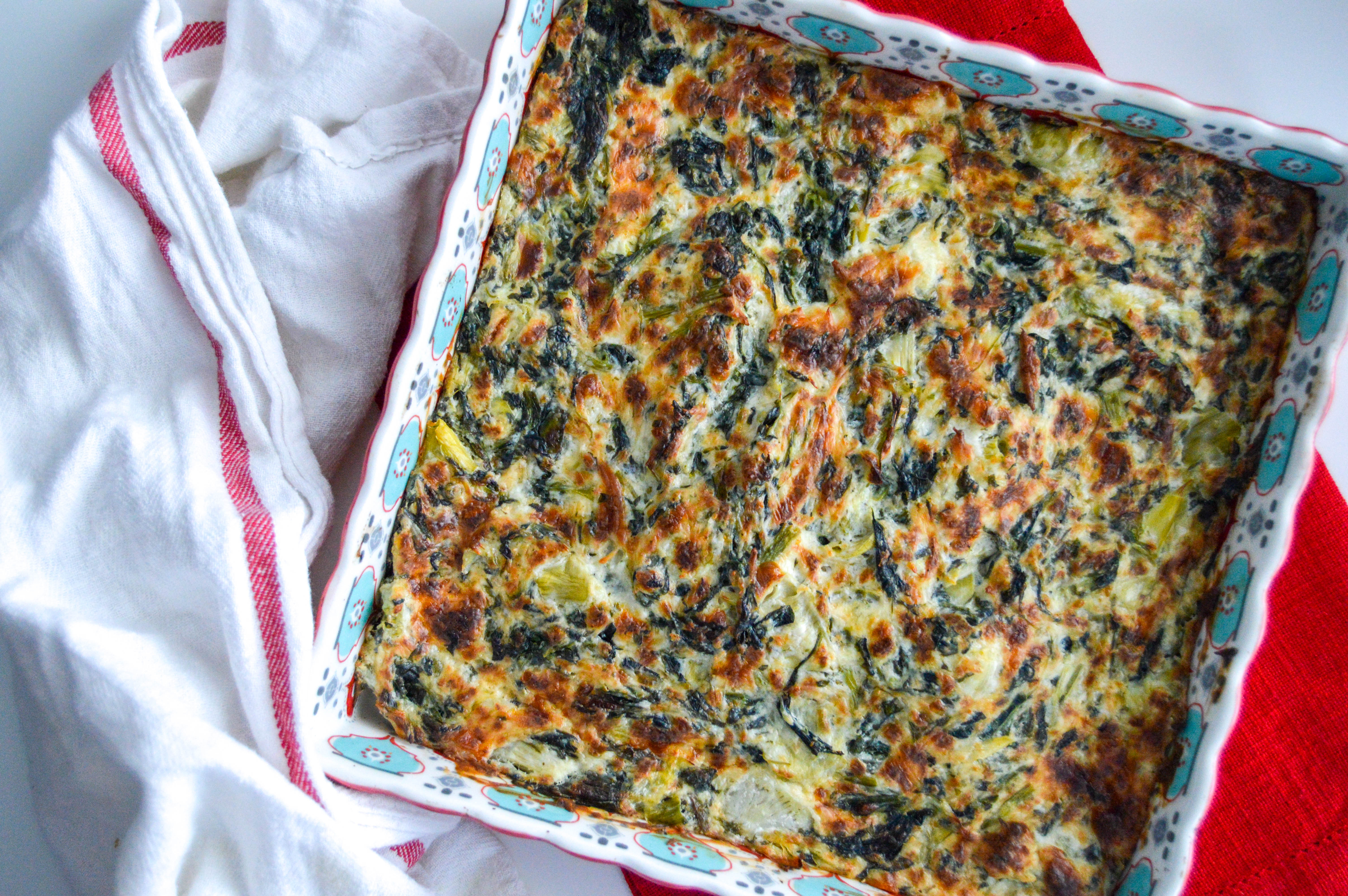 Cheesy spinach artichoke dip recipe that's easy and cheesy. Includes ingredients and directions. Oven baked and served with baguette and Diet Coke. Perfect appetizer for party food or dinner.