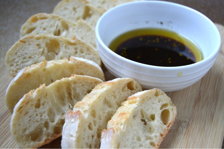 Sliced ciabatta baguette with balsamic vinegar dip side dish. Romantic dinner menu for a date night in in that you can make in 15 minutes! Quick + easy fancy meal at home. Pasta main course, salad, + side dish recipes.
