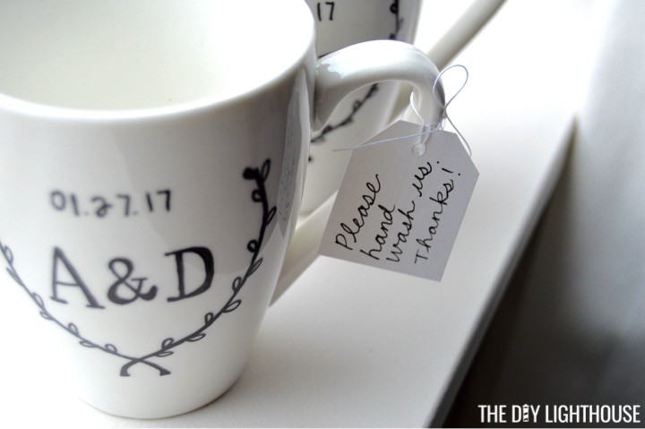 How to make DIY Sharpie mugs with the bride + groom 's initials / wedding date. DIY Sharpie wedding mugs is a cute + personalized wedding present craft idea.