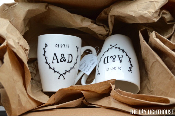 How to make DIY Sharpie mugs with the bride + groom 's initials / wedding date. DIY Sharpie wedding mugs is a cute + personalized wedding present craft idea.