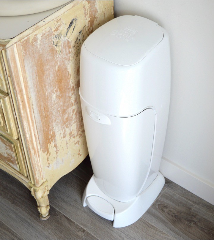 Diaper Genie for your diaper pail | Tips for how to make a practical diaper changing station. Changing table ideas like: repurpose a dresser, get a Diaper Genie, buy diapers and wipes in bulk, baby changing pad + more ideas for your baby's nursery. DIY dresser changing table hack. Tips and tricks for when baby comes like where to go shopping for a diaper pail.