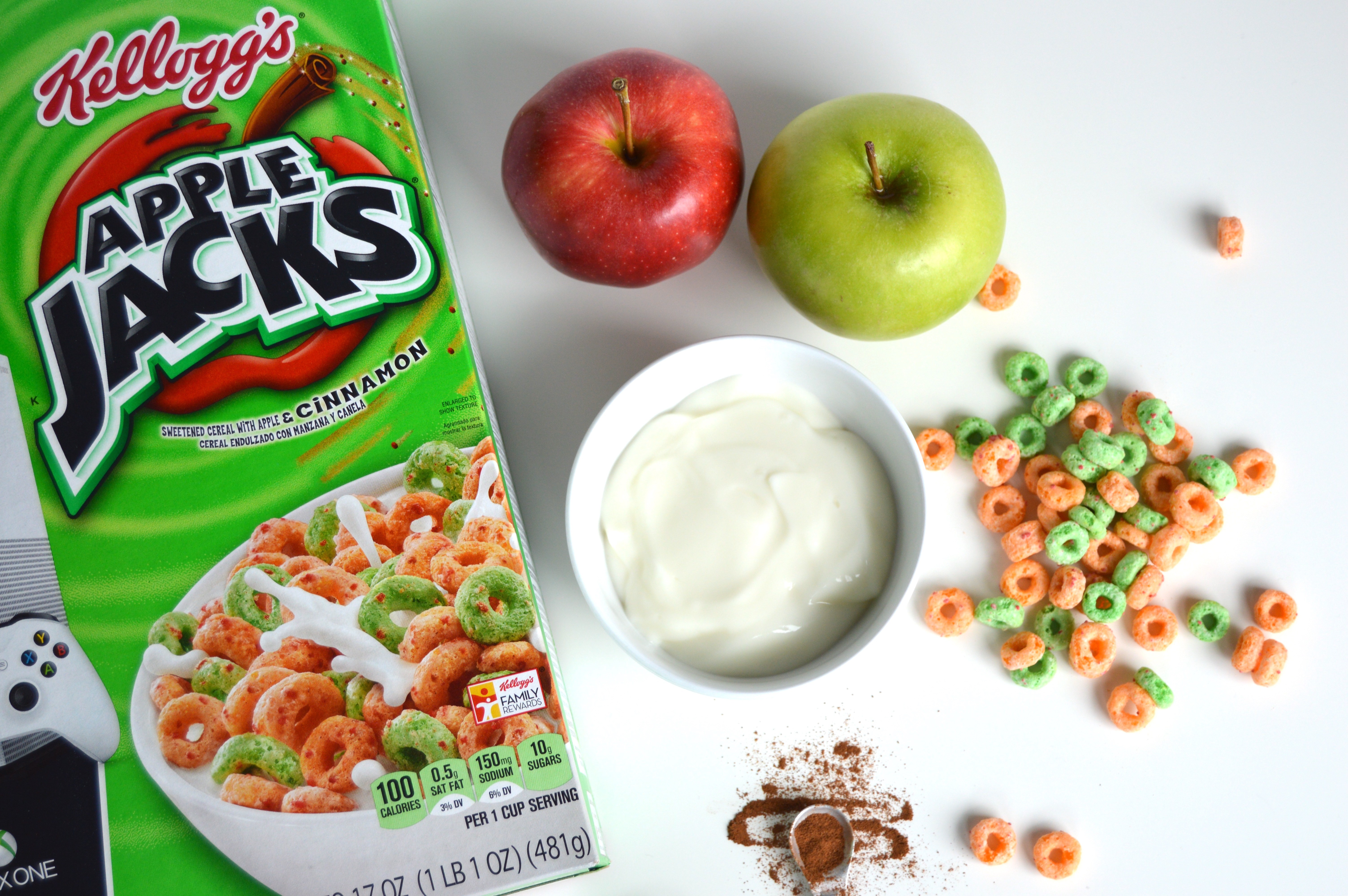 Apple Jacks Cereal Yogurt Parfait ingredients: Apple Jacks, vanilla yogurt, apples, and a sprinkle of cinnamon