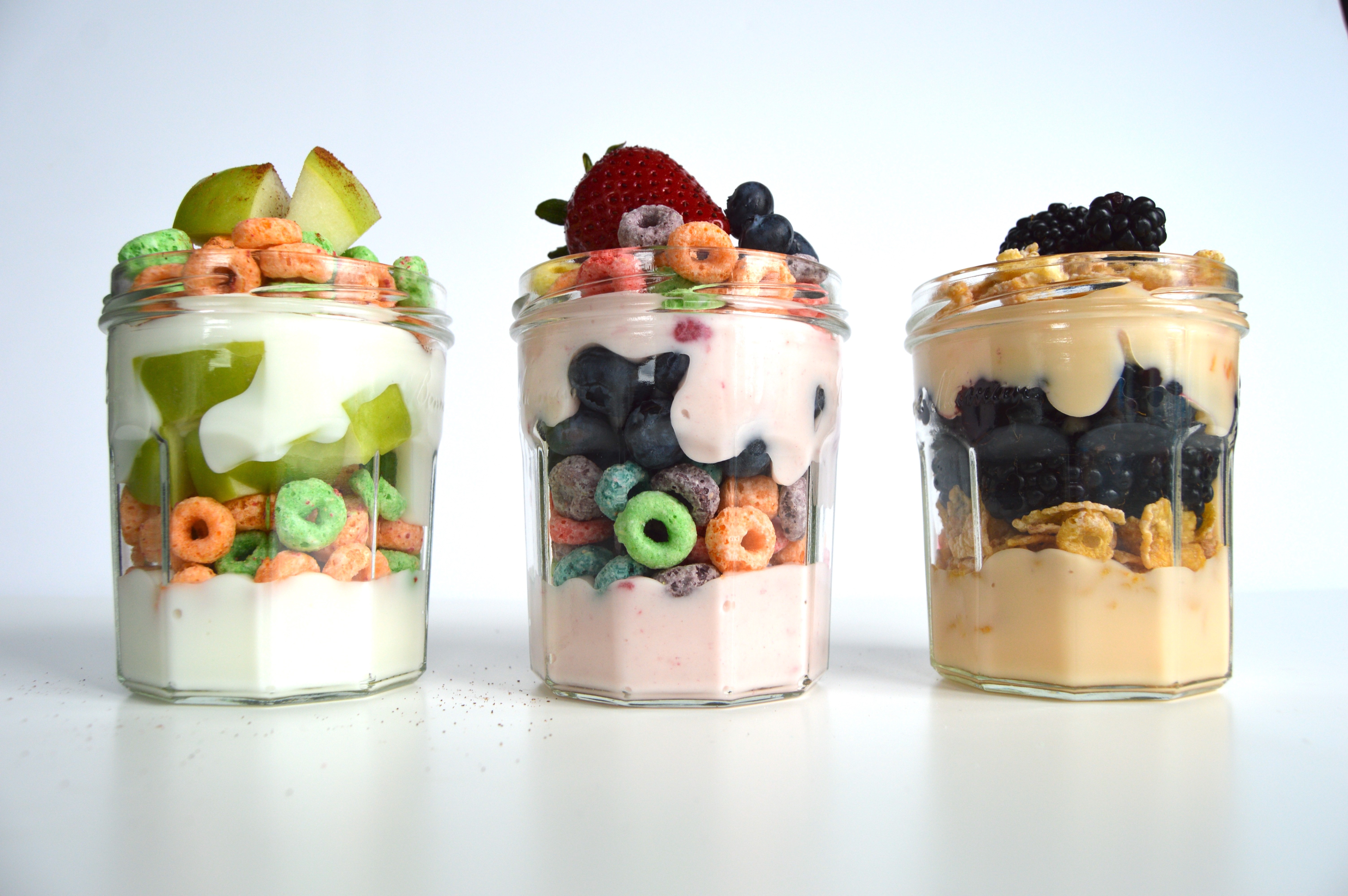 Layered cereal yogurt parfait with fruit for a fun breakfast. Ideas for Kellogg cereal parfait: Apple Jacks, Froot Loops, and Frosted Flakes. Fun breakfast idea!