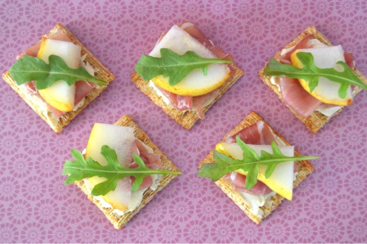 Fancy cheese and crackers recipe for the foodie with TRISCUIT Crackers, creamy cheese spread, prosciutto, pear, and arugula leaves. Perfect appetizer or snack. Delicious food to make for a party or just for fun with the kids. 