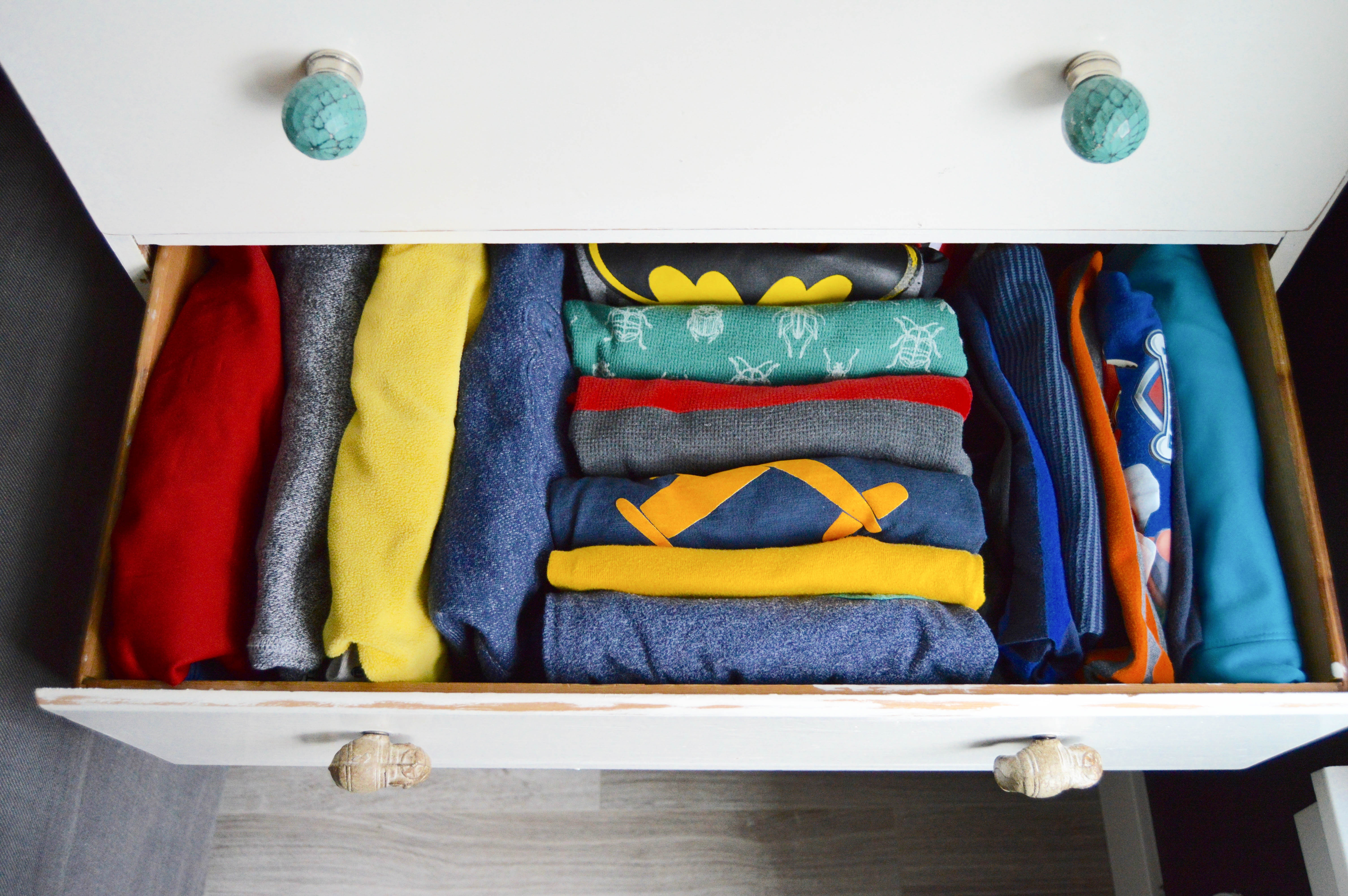 Tips for how to purge and organize your home like a pro. Organizing steps: categorizing and finding homes for things. 5 home organizing rules to live by. Kid clothes in a drawer