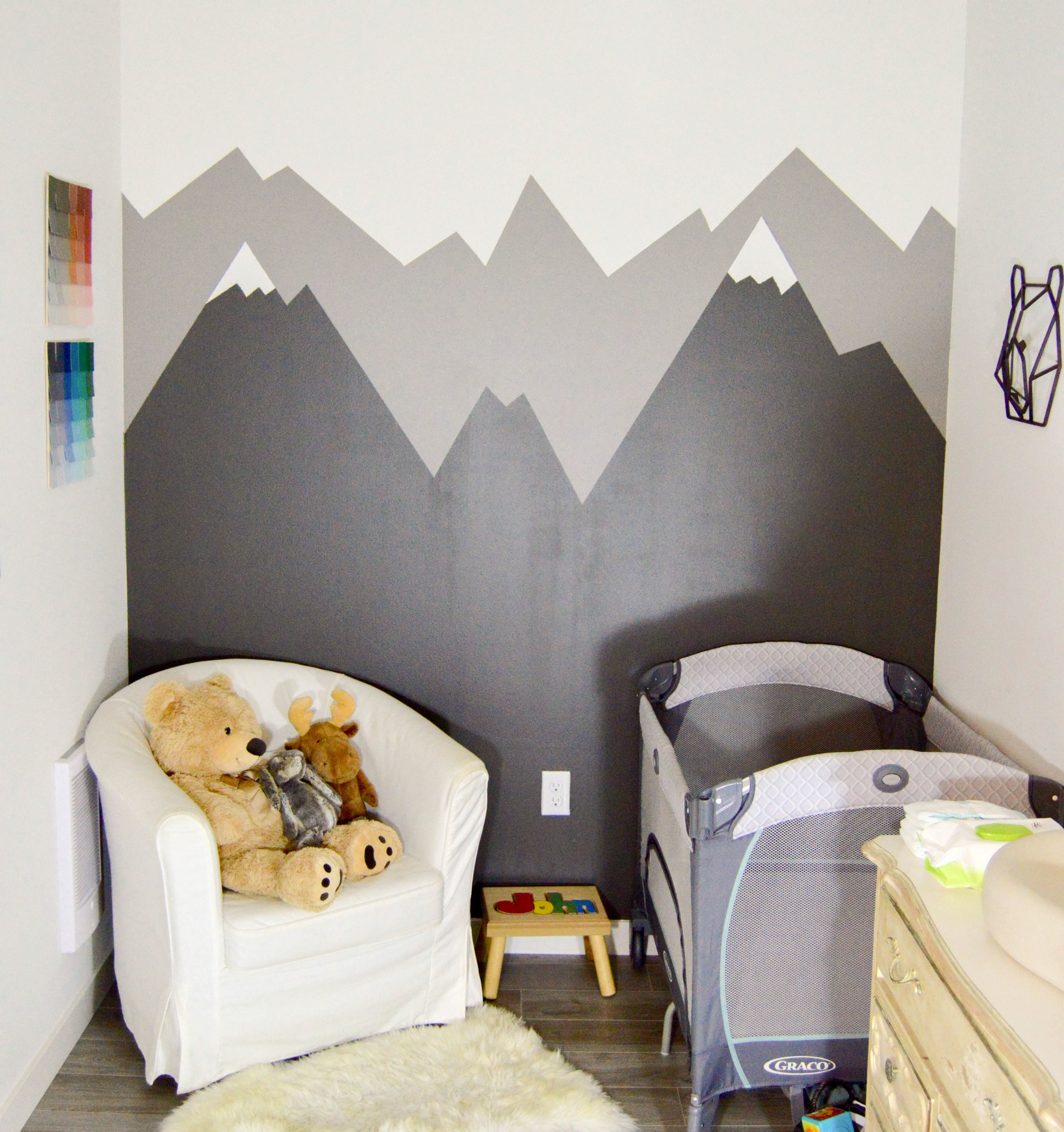 DIY Mountain Wall Mural - Small PNW (Pacific Northwest) outdoor theme nursery with mountains + animals for our baby boy. Mountain mural and paint chip art tutorial for woodland feel.