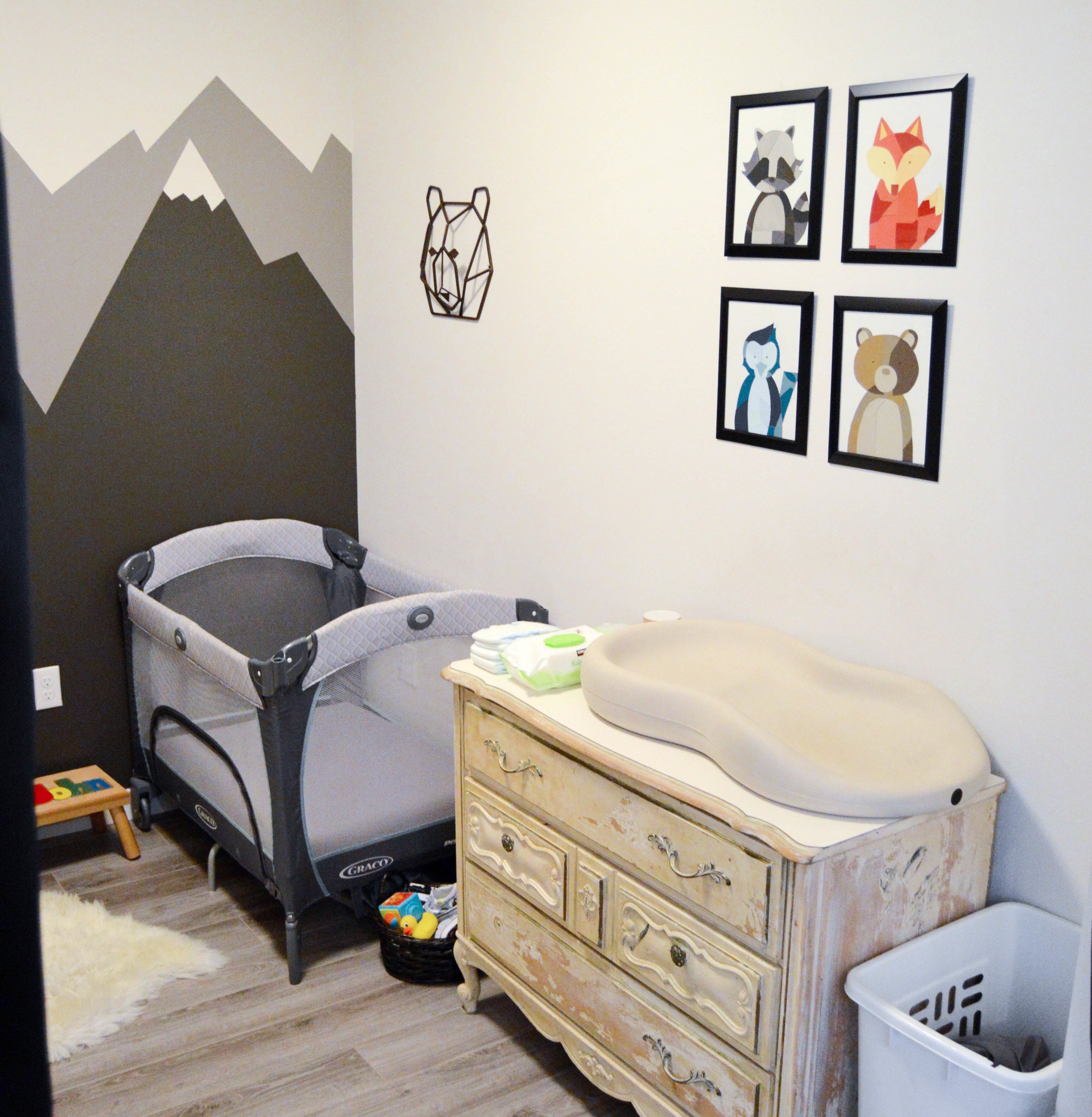 Paint Chip Art - Small PNW (Pacific Northwest) outdoor theme nursery with mountains + animals for our baby boy. Mountain mural and paint chip art tutorial for woodland feel.