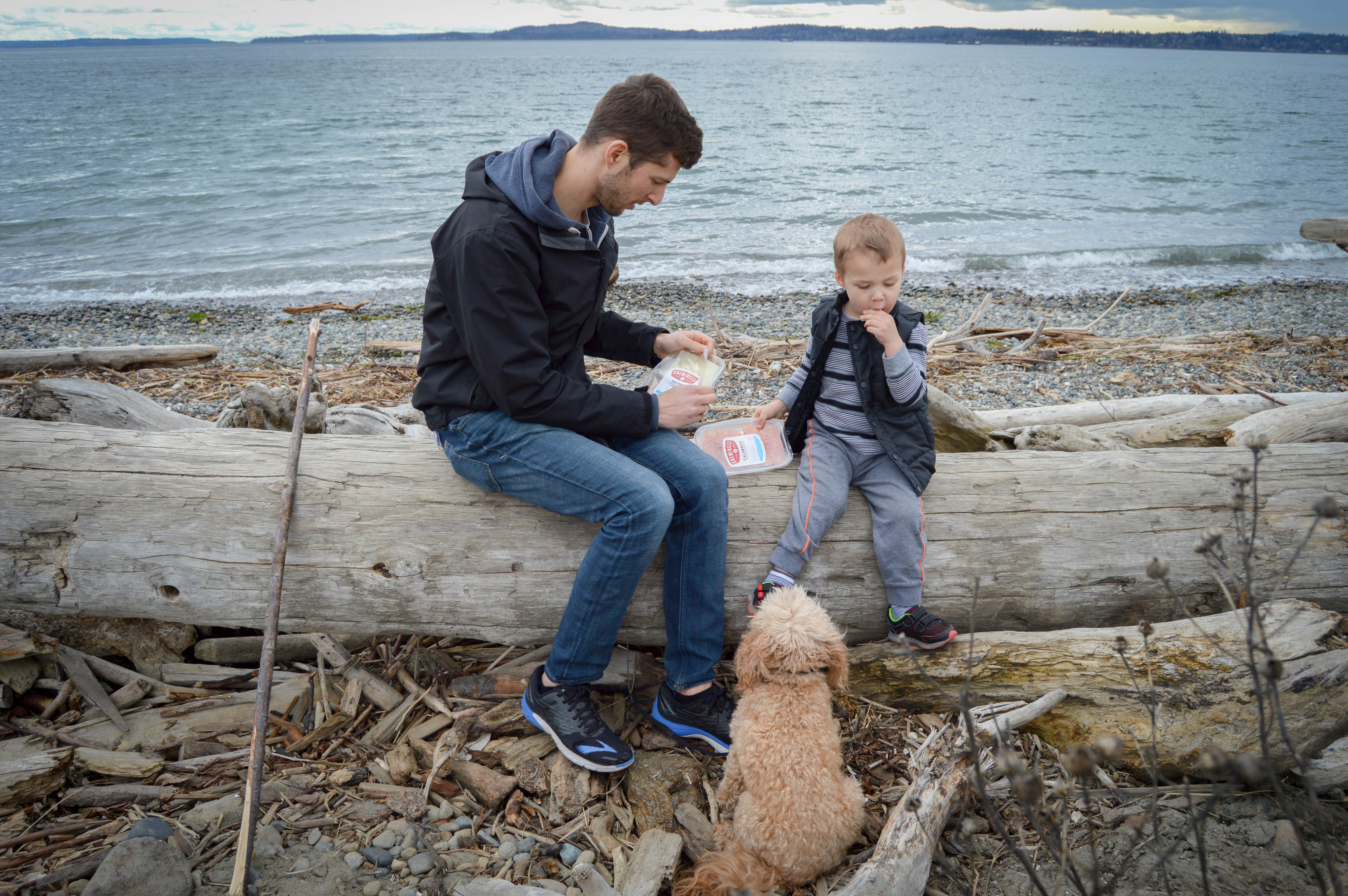Our family's adventure through Discovery Park in Seattle, WA. Walking trail that twists through the lush, mossy trees; driftwood beaches, an old lighthouse, and stunning views of the Puget Sound water; and refueling with our protein-packed Creminelli snack trays.