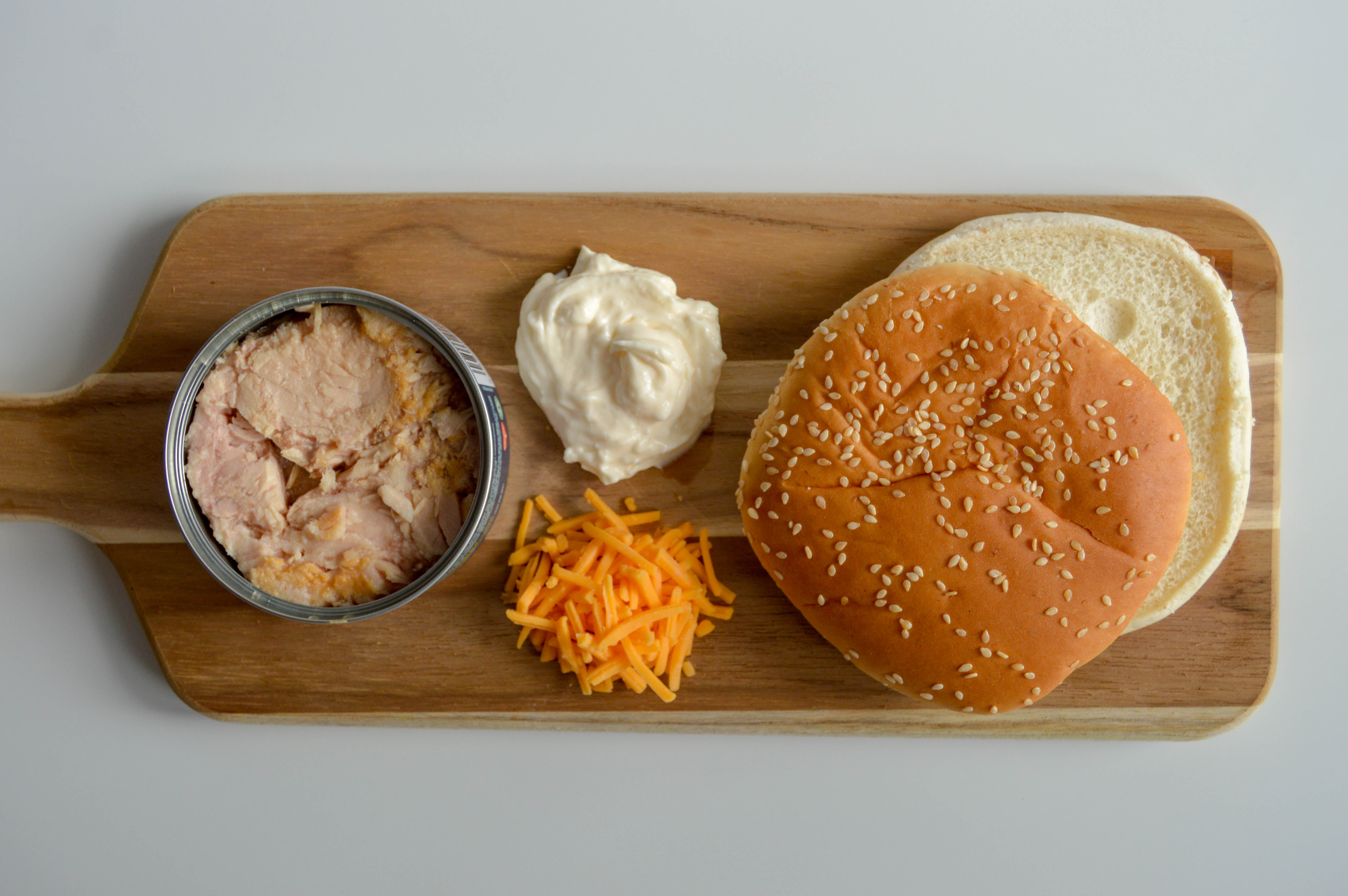 Simple ingredients for how to make tuna melt bunwiches.