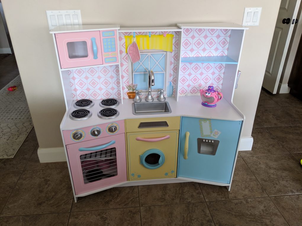 Before picture of our kids play kitchen that we gave a makeover.