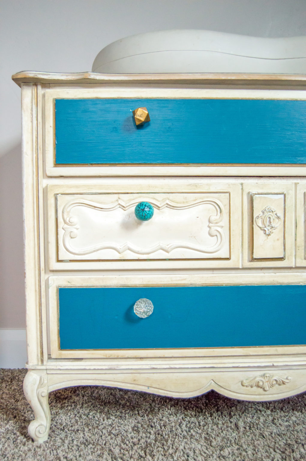 Cute knobs on dresser changing table - teal paint