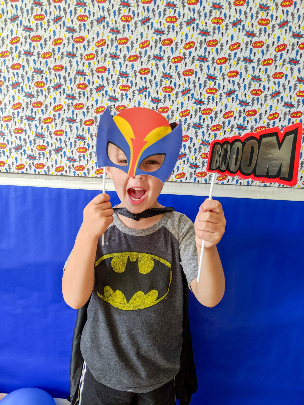 Superhero party activity - superhero DIY photo booth and photo wall with props. 