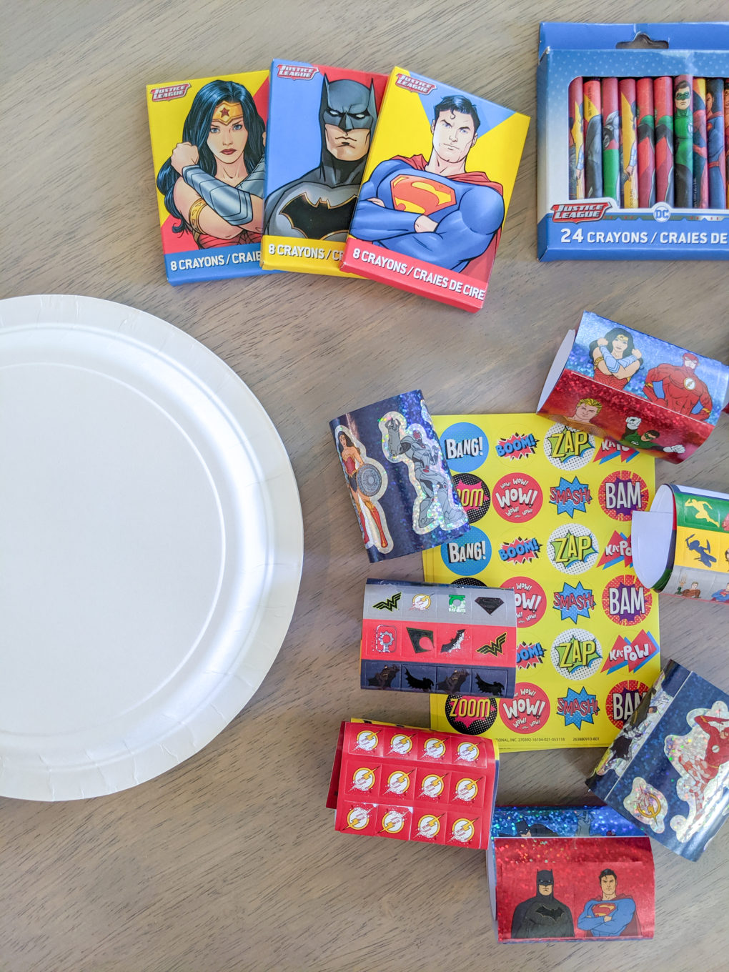 Superhero party activity - make your own shield. Superhero themed birthday party ideas for a toddler party. I'm sharing our cute superhero activities and games, birthday cake, and party favor inspiration.
