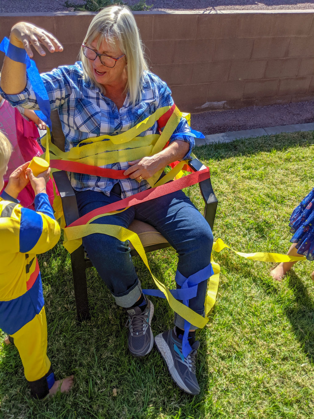 Superhero party activity - tie up the villains with streamers