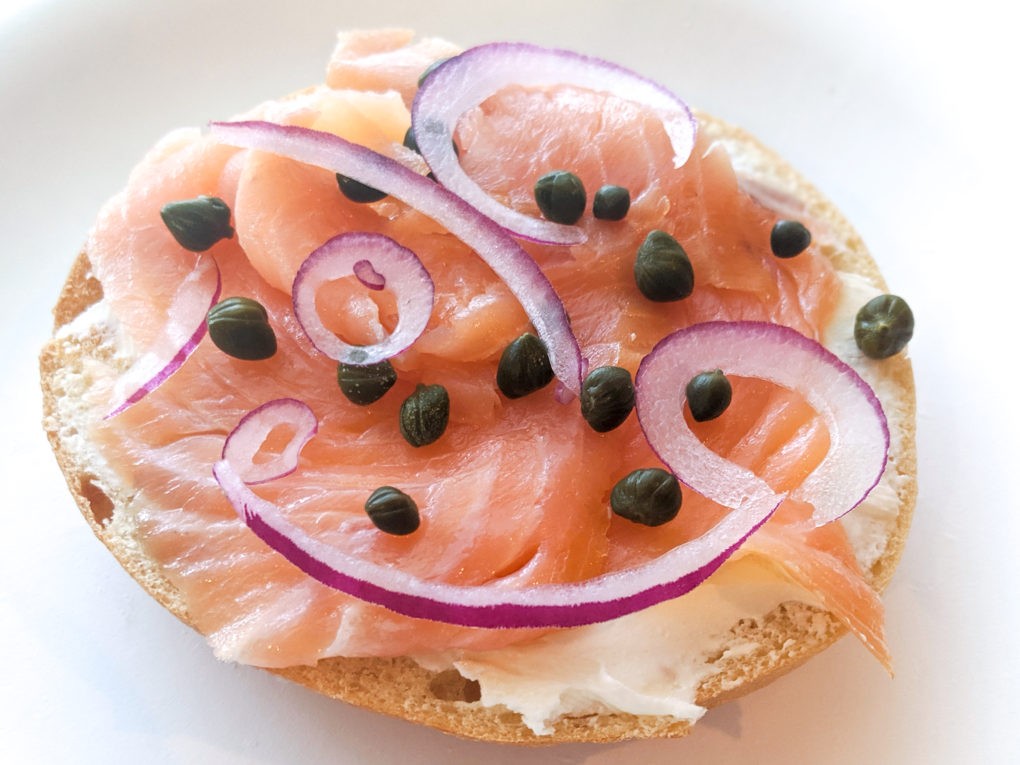 What is bagel and lox. My version with cream cheese smear, lox, capers, and red onion.