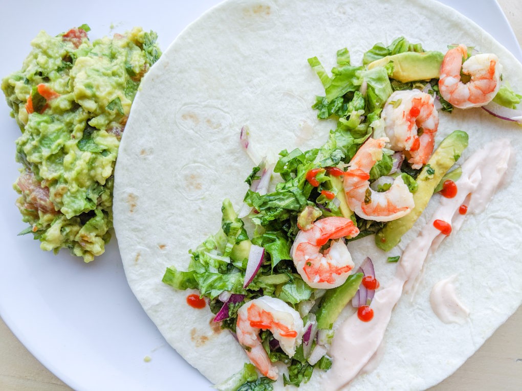 Shrimp tacos with guacamole for our women's wellness retreat on a budget. Girl's trip healthy meal ideas and menu plan.