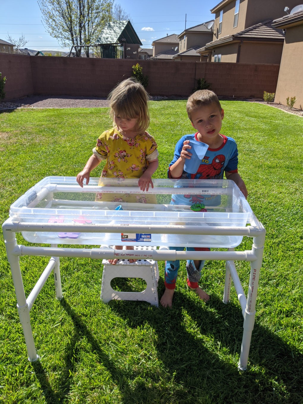 Tutorial for how to make your own DIY PVC pipe water table for backyard fun with the kids this summer. Easy and simple outside entertainment for toddlers.