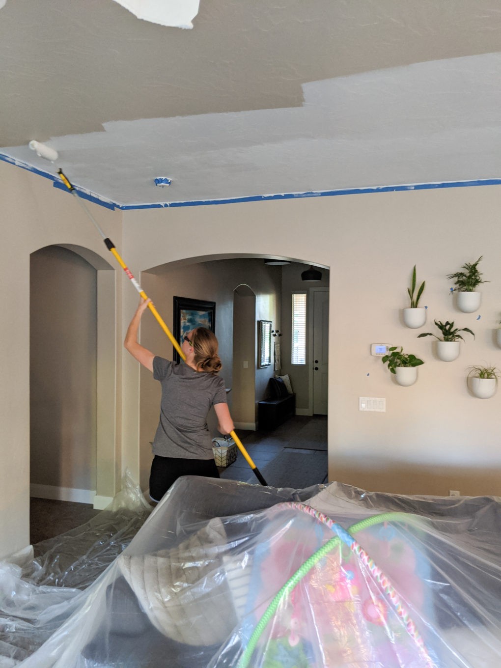 Painting ceiling white with a roller